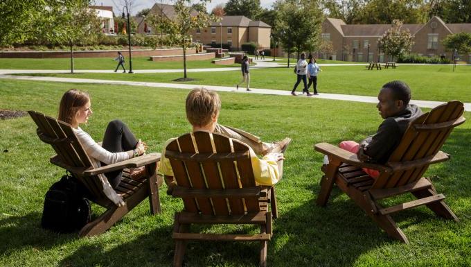 Students in Adirondack chairs